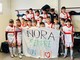 Le due leve della Genova Calcio con lo striscione per Nora